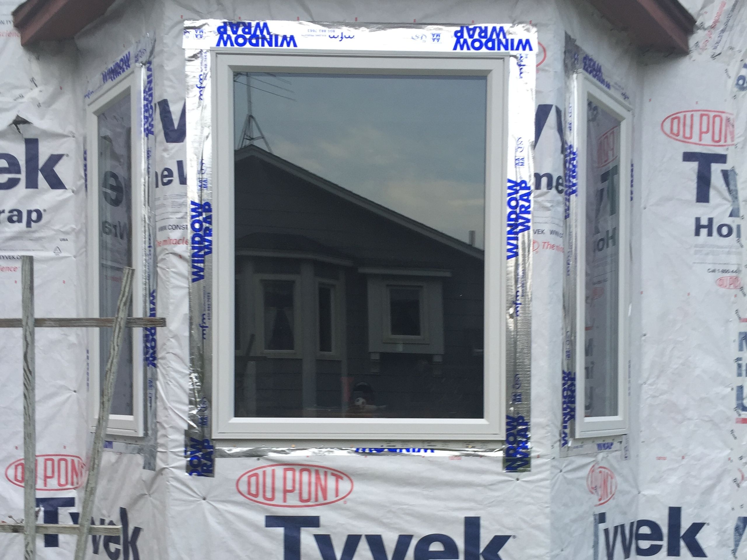 Replacement window with fresh aluminum trim wrap