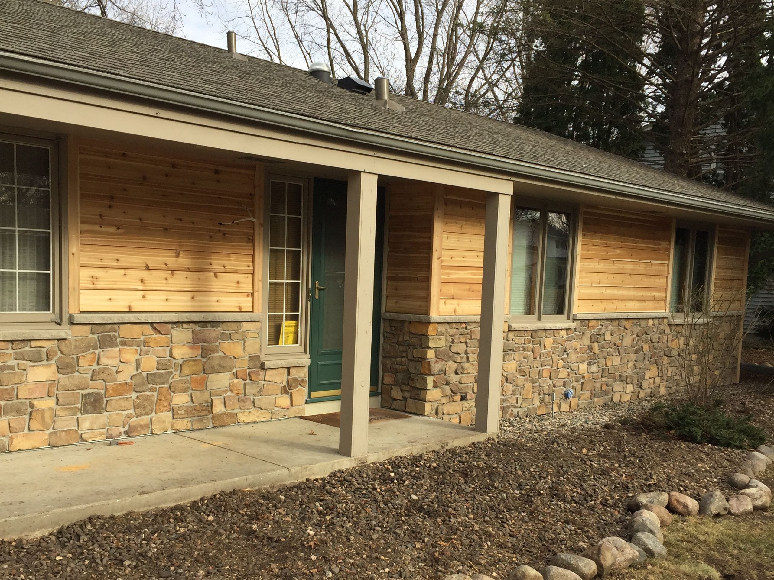 Cedar Siding and stone on a cabin-style ranch