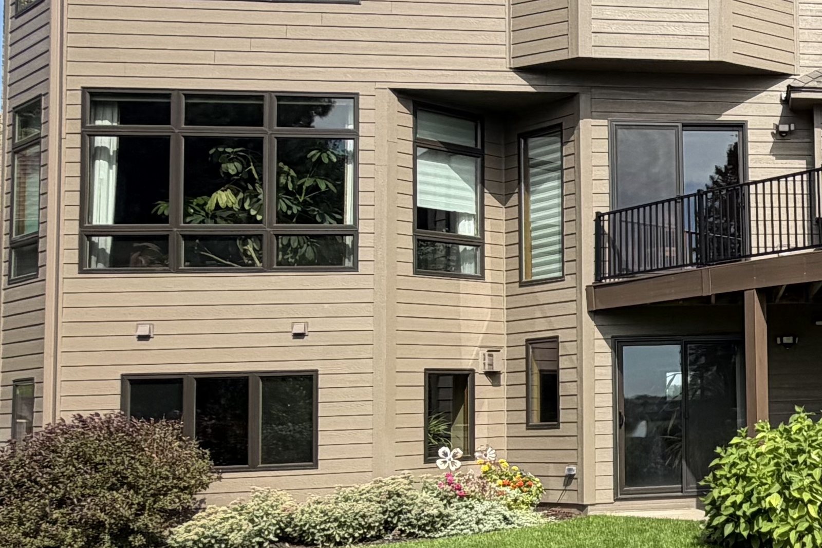 Trim boards around Windows and a corner on tan lap Siding