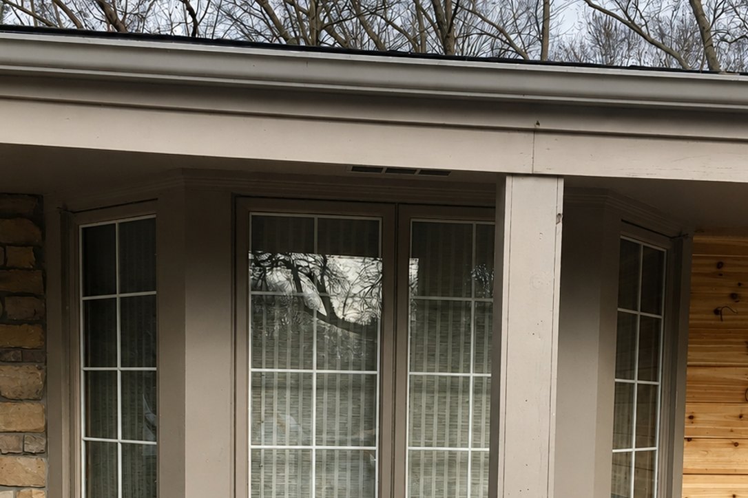 Bay window wrapped in new Siding and trim