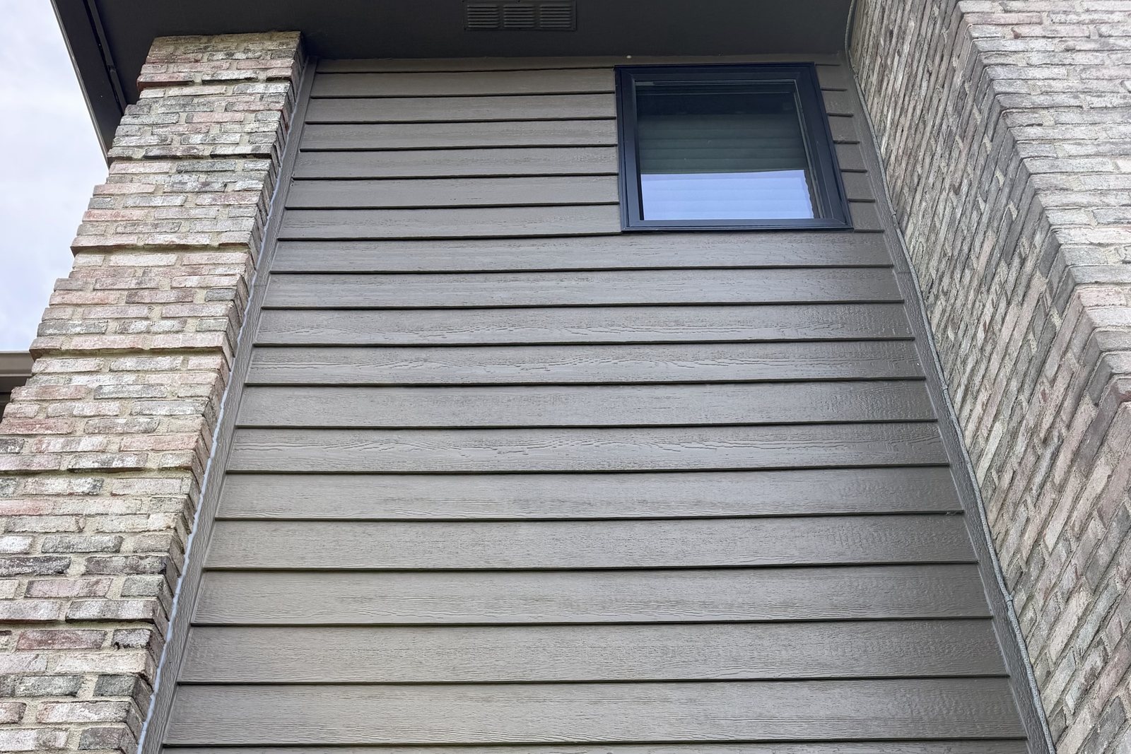 Lap Siding courses and shadow lines running up a gable wall