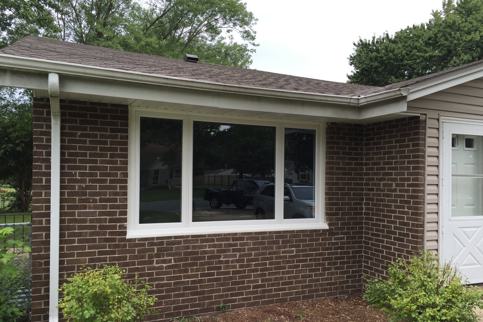 New picture window installed in a brick wall